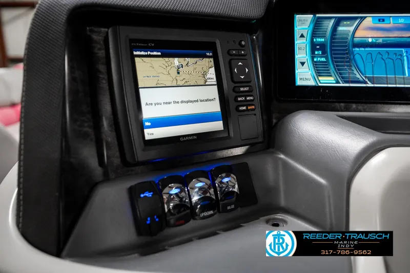 Slide: The Image of 2019 Avalon Ambassador boat dashboard with Garmin GPS and control panel. - 42