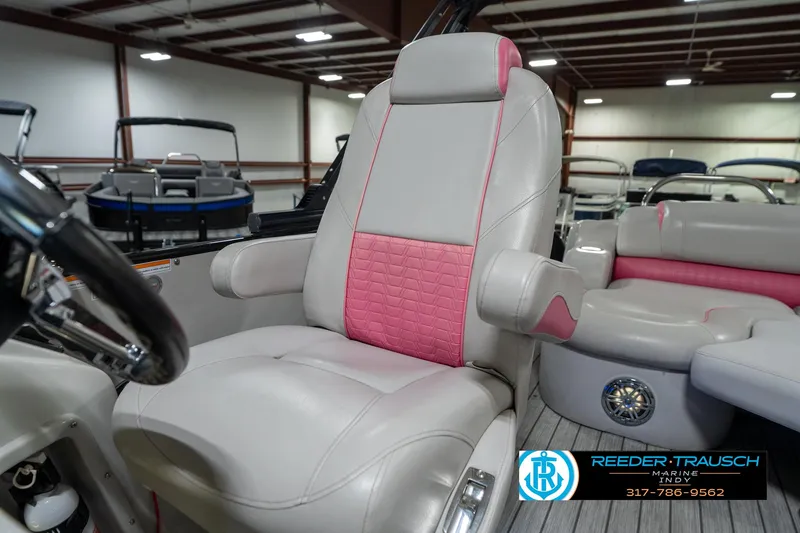 Slide: The Image of Luxurious seating in 2019 Avalon Ambassador 27' boat, featuring pink accents and modern design. - 47