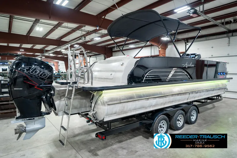 Slide: The Image of 2019 Avalon Ambassador 27' pontoon boat with Mercury 400 engine in showroom. - 8