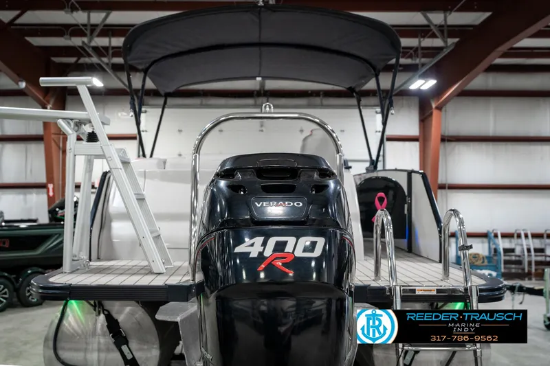 Slide: The Image of 2019 Avalon Ambassador 27' with Verado 400R engine in showroom. - 9