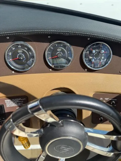 Slide: The Image of Dashboard of 2020 Cobalt CS23 boat with steering wheel and gauges. - 13