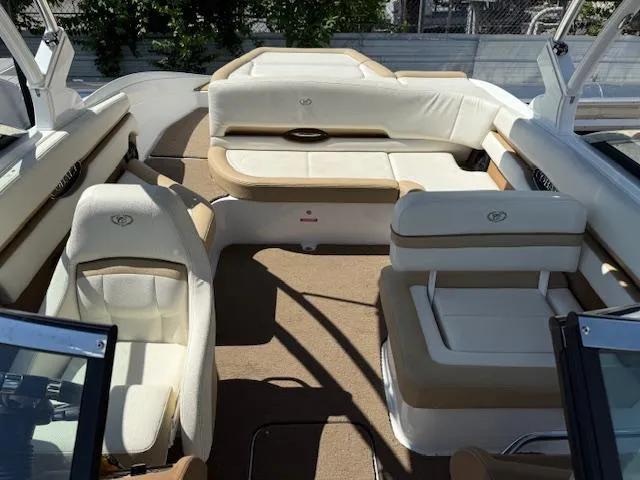 Slide: The Image of 2020 Cobalt CS23 boat interior with beige and white seating arrangement. - 17