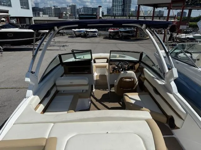 Slide: The Image of Interior view of a 2020 Cobalt CS23 boat with seating and steering wheel. - 22