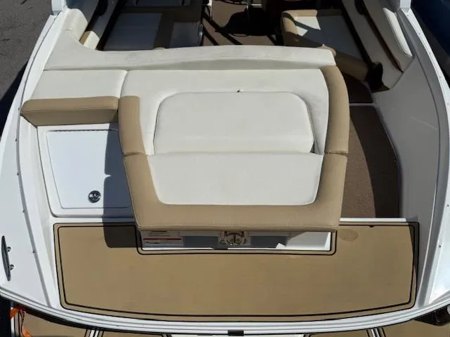 Slide: The Image of 2020 Cobalt CS23 boat interior with beige and white seating. - 23