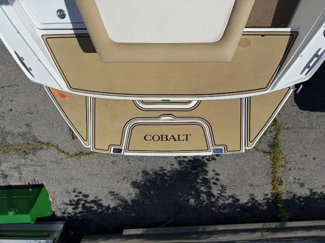Slide: The Image of 2020 Cobalt CS23 boat deck with tan and white design. - 26