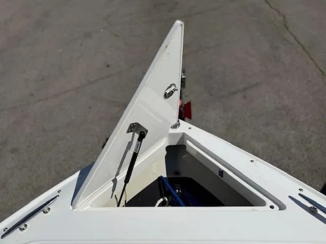 Slide: The Image of Open storage compartment on 2020 Cobalt CS23 boat. - 5