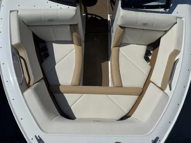 Slide: The Image of 2020 Cobalt CS23 boat interior with white and beige seating, top view. - 6