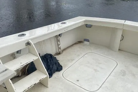 Slide: The Image of 1984 Post 43 Sport Fisherman boat deck with steps and storage hatch. - 7
