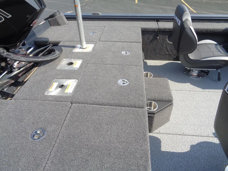 Slide: The Image of 2025 Lund 1875 Pro-V Bass XS boat interior with seating and storage compartments. - 17