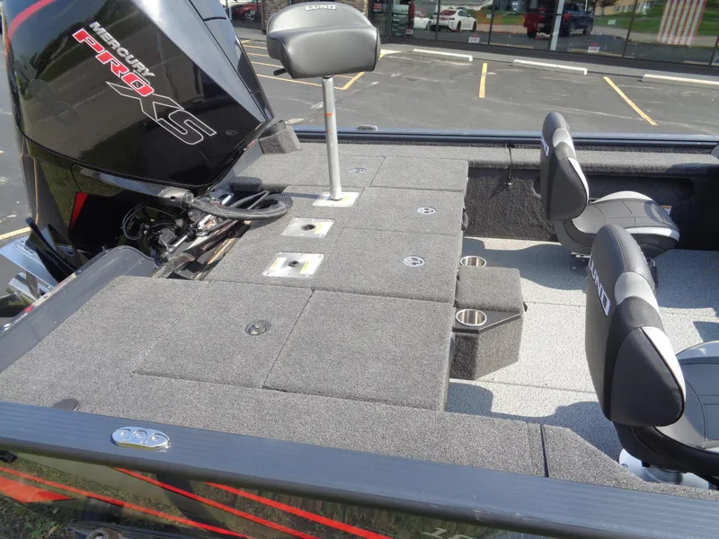 Slide: The Image of 2025 Lund 1875 Pro-V Bass XS boat interior with Mercury Pro XS engine, spacious seating, and storage. - 20
