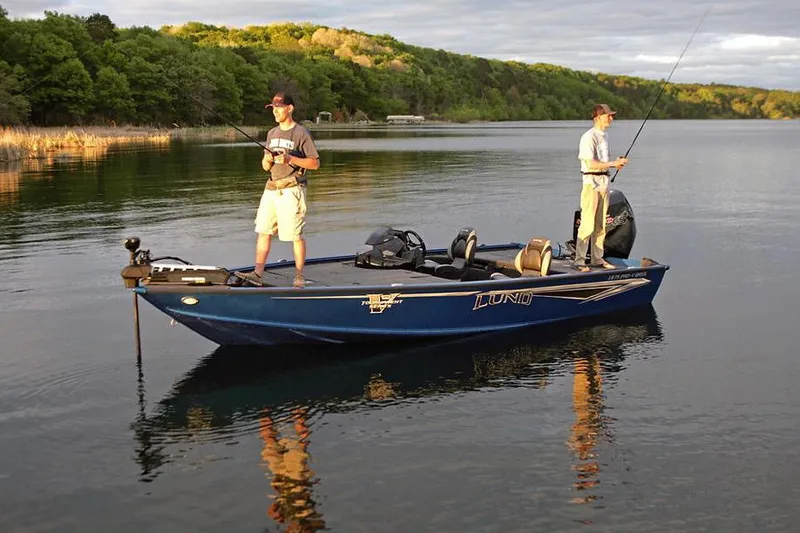 Slide: The Image of Manufacturer Provided Image: Two people fishing on a 2025 Lund 1875 Pro-V Bass XS boat. - 25