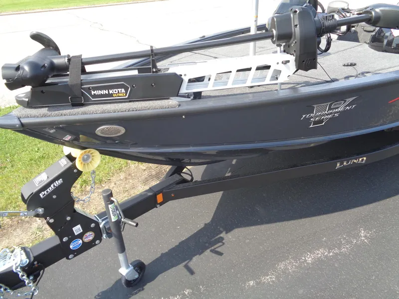 Slide: The Image of 2025 Lund 1875 Pro-V Bass XS boat with Minn Kota Ultrex motor on trailer. - 4