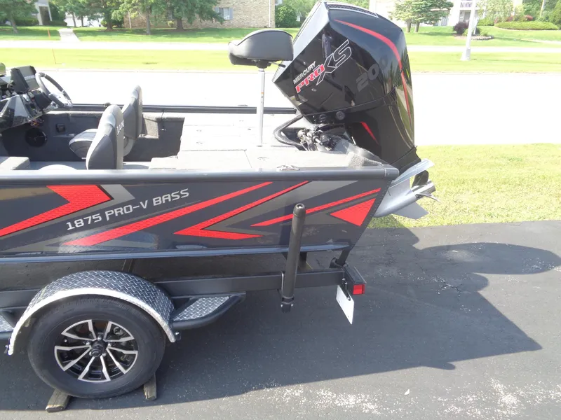 Slide: The Image of 2025 Lund 1875 Pro-V Bass XS boat with Mercury Pro XS engine on trailer. - 5