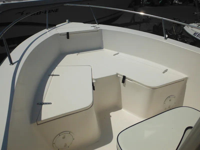 Slide: The Image of 2004 Sea Hunt 202 TRITON boat interior with storage compartments and seating. - 12