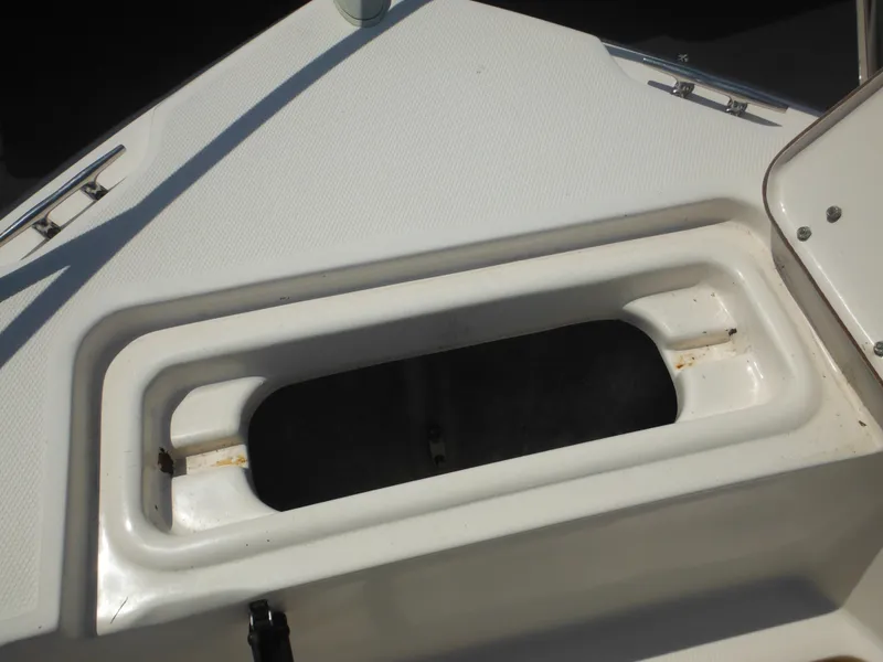 Slide: The Image of Open storage compartment on 2004 Sea Hunt 202 TRITON boat deck. - 14