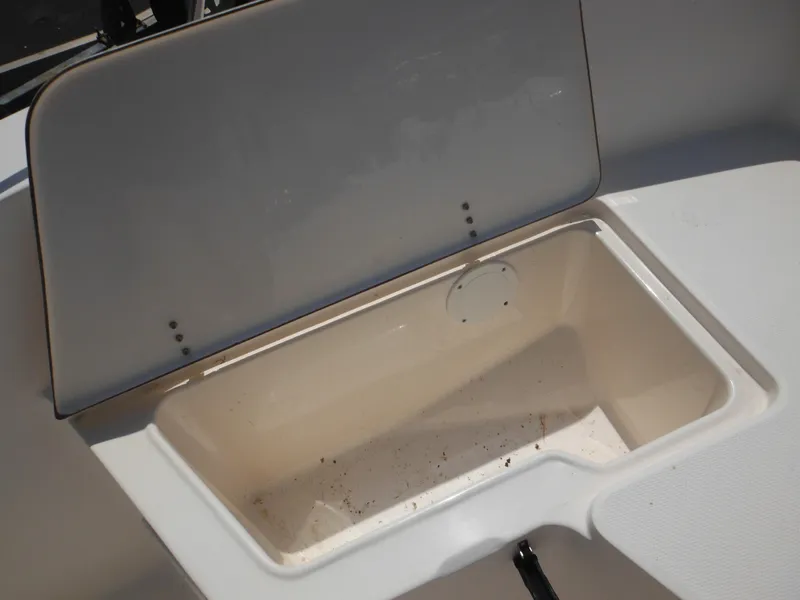 Slide: The Image of Open storage compartment on a 2004 Sea Hunt 202 TRITON boat. - 16