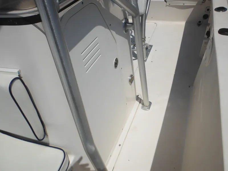 Slide: The Image of 2004 Sea Hunt 202 TRITON boat interior with white deck and metal railing. - 21