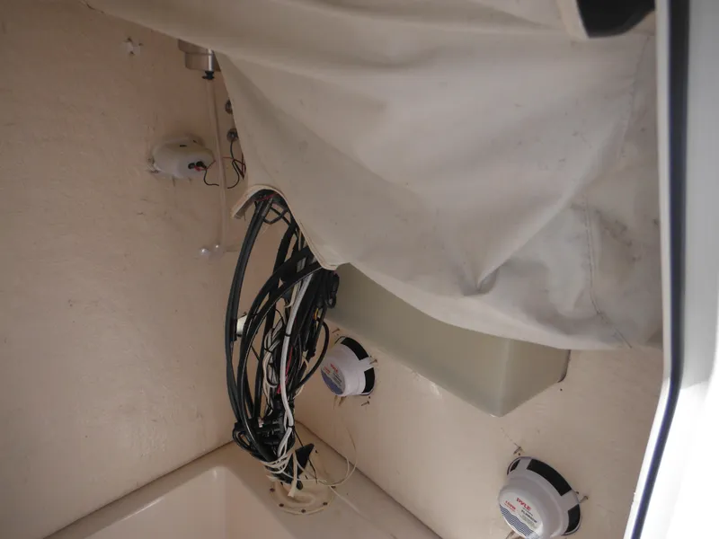 Slide: The Image of Interior view of a 2004 Sea Hunt 202 TRITON boat showing wiring and components. - 23