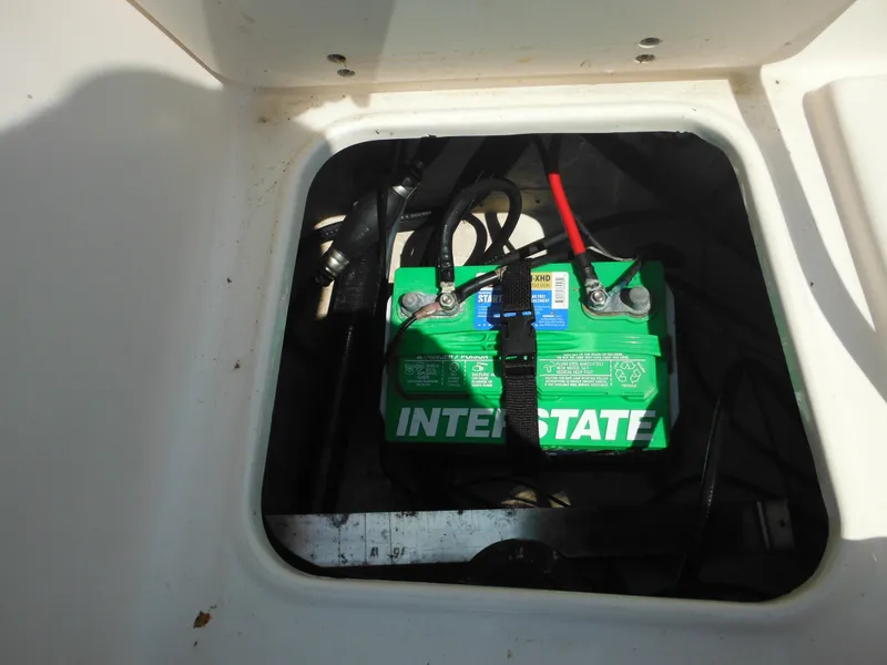 Slide: The Image of Battery compartment of a 2004 Sea Hunt 202 TRITON boat with Interstate battery. - 30