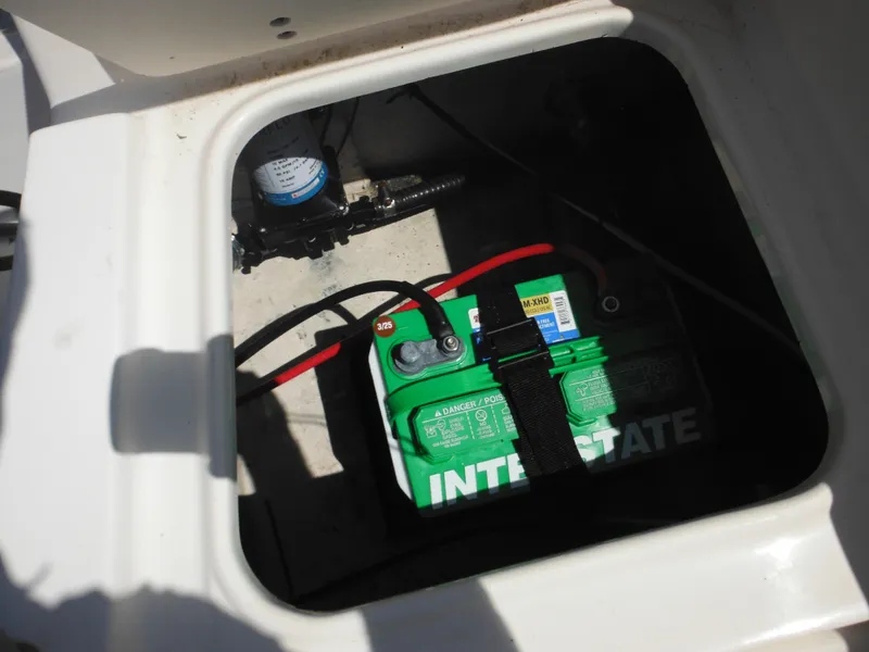 Slide: The Image of Battery compartment of 2004 Sea Hunt 202 TRITON boat with Interstate battery. - 34