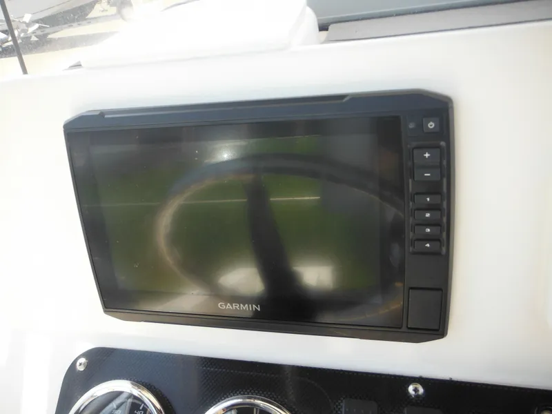 Slide: The Image of Garmin display on 2004 Sea Hunt 202 TRITON boat dashboard. - 43