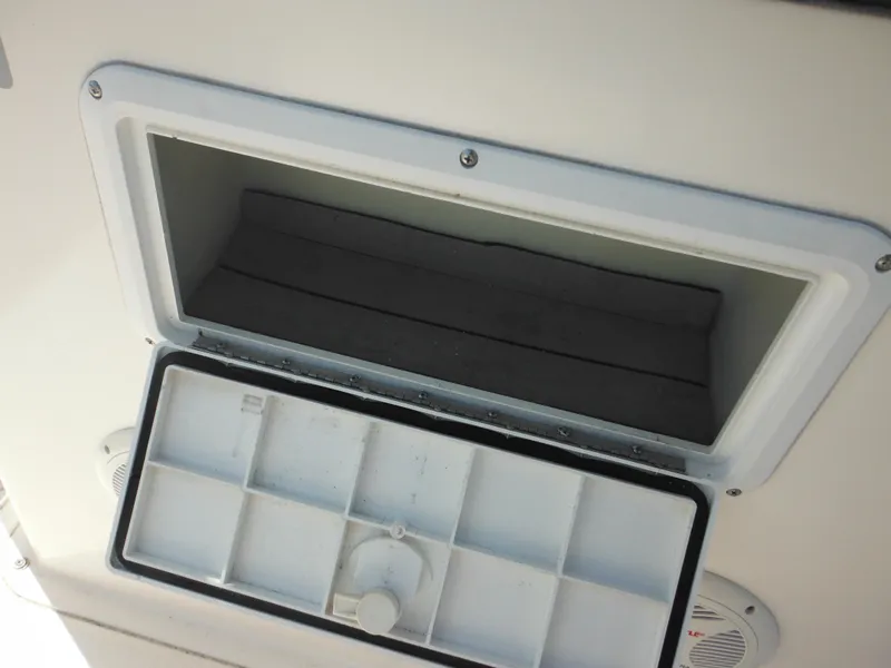 Slide: The Image of Open storage compartment on a 2004 Sea Hunt 202 TRITON boat. - 45
