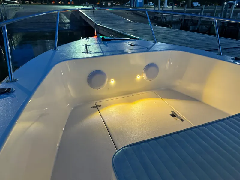 Slide: The Image of Interior of 1987 Custom Biddison 2200 boat with ambient lighting at dock. - 12