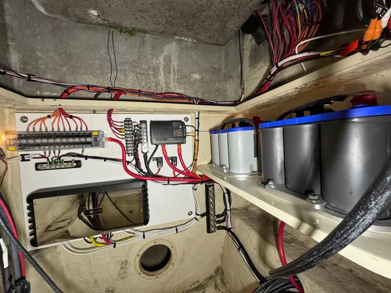 Slide: The Image of Electrical system of a 1987 Custom Biddison 2200 with wiring and batteries. - 18