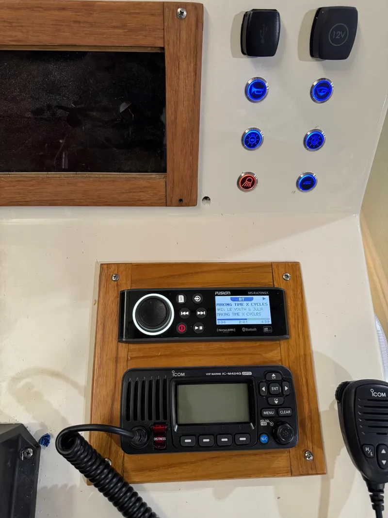 Slide: The Image of Boat control panel with radio and switches, Custom Biddison 2200, 1987 model. - 2