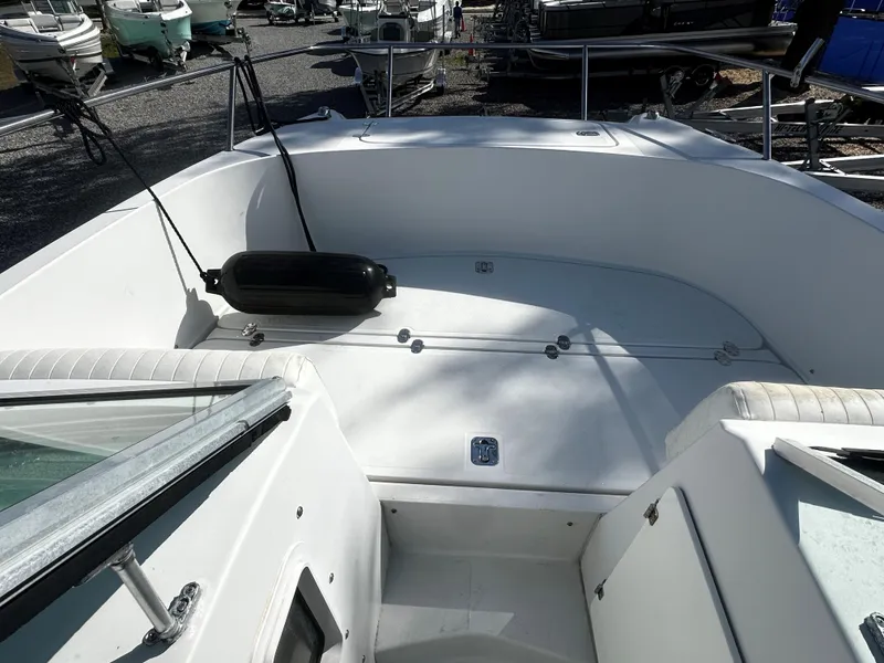 Slide: The Image of 2006 Glacier Bay 2600 boat on trailer under clear blue sky. - 5