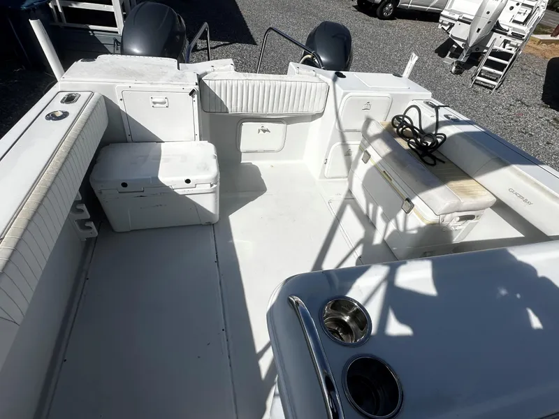 Slide: The Image of 2006 Glacier Bay 2600 boat interior with seating and steering console. - 6