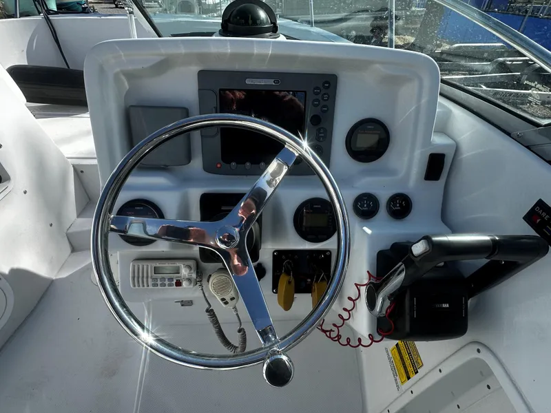 Slide: The Image of 2006 Glacier Bay 2600 boat interior with seating and storage compartments. - 8