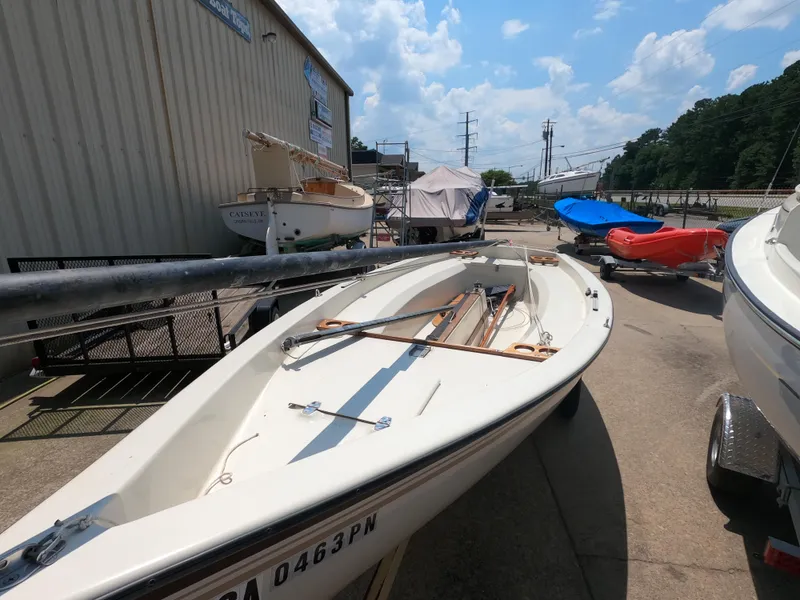 Slide: The Image of 1980 Spindrift Rascal 14 sailboat on trailer, outdoor storage area, sunny day. - 3