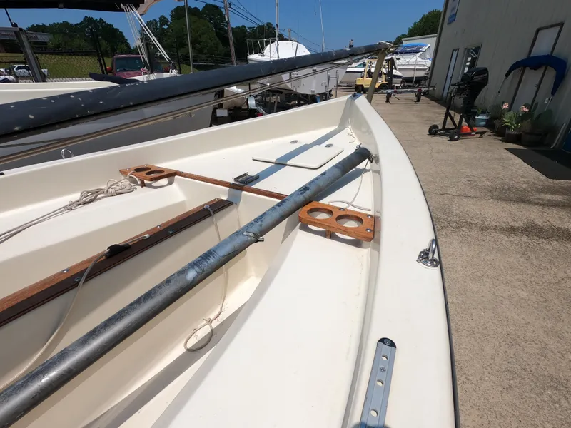 Slide: The Image of 1980 Spindrift Rascal 14 sailboat on a sunny day, docked at a marina. - 5
