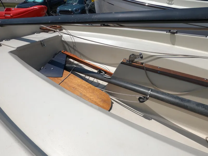 Slide: The Image of 1980 Spindrift Rascal 14 sailboat interior with wooden and metal components. - 6