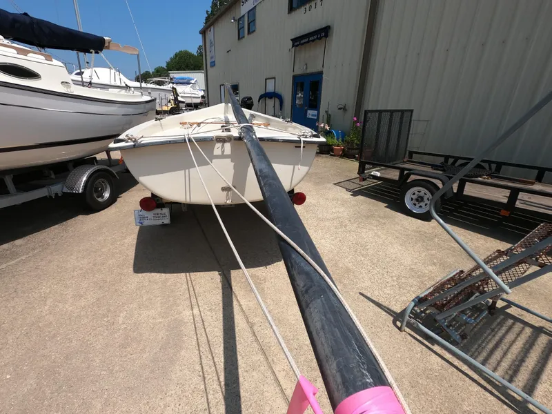 Slide: The Image of 1980 Spindrift Rascal 14 sailboat on trailer, displayed outdoors for sale. - 8