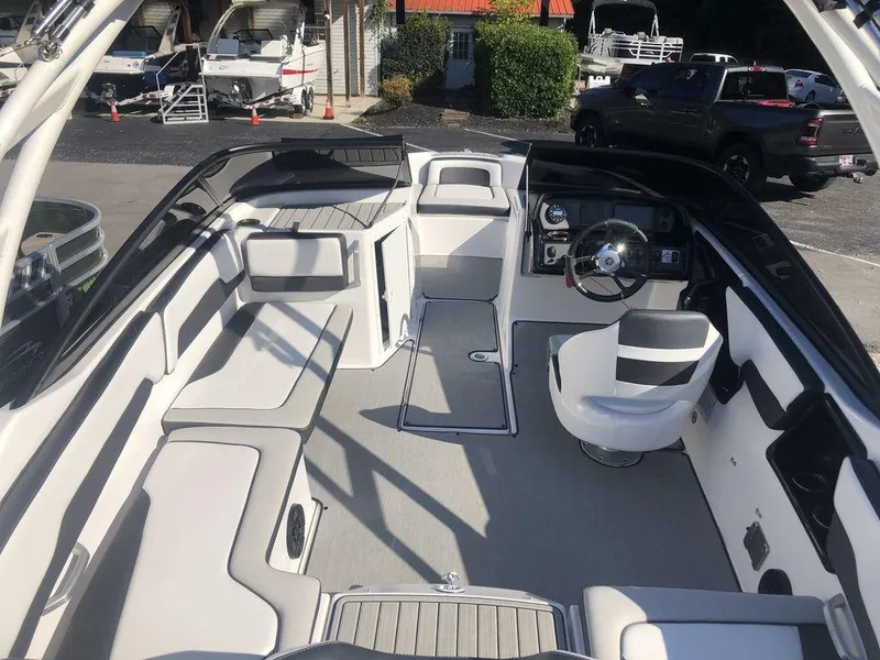 Slide: The Image of 2023 Yamaha Boats AR195 interior with sleek seating and modern dashboard design. - 5