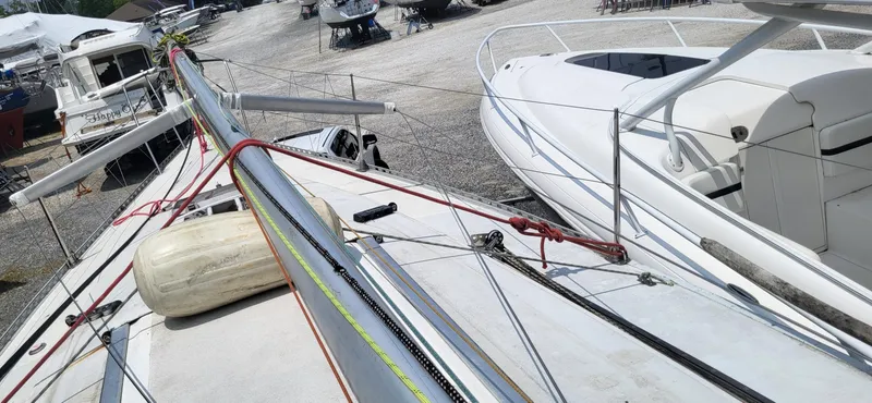 Slide: The Image of Beneteau First Class 10 sailboat, 1983 model, docked with visible mast and rigging. - 3