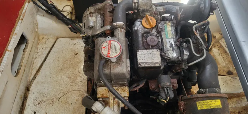 Slide: The Image of Engine compartment of a 1983 Beneteau First Class 10 sailboat, featuring a Yanmar engine. - 6