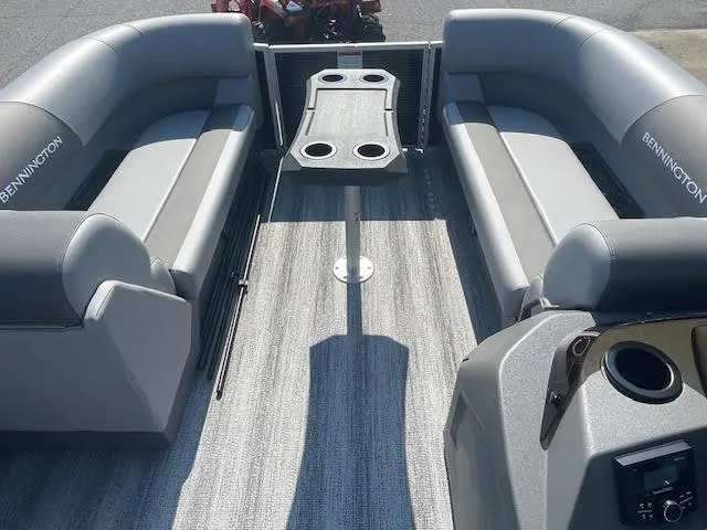 Slide: The Image of 2025 Bennington 22S pontoon boat interior with gray seating and central table. - 5
