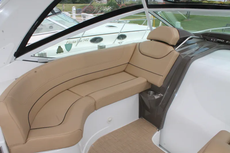 Slide: The Image of 2014 Cruisers Yachts 350 Express interior with beige seating and modern design. - 11