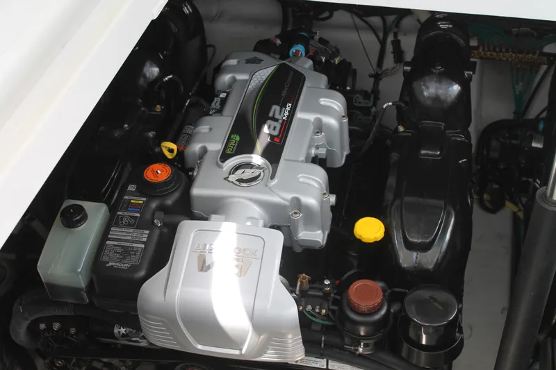 Slide: The Image of 2014 Cruisers Yachts 350 Express engine compartment, showcasing a powerful inboard motor. - 23