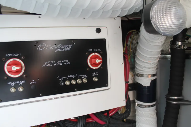 Slide: The Image of 2014 Cruisers Yachts 350 Express engine panel with battery isolator and wiring. - 27