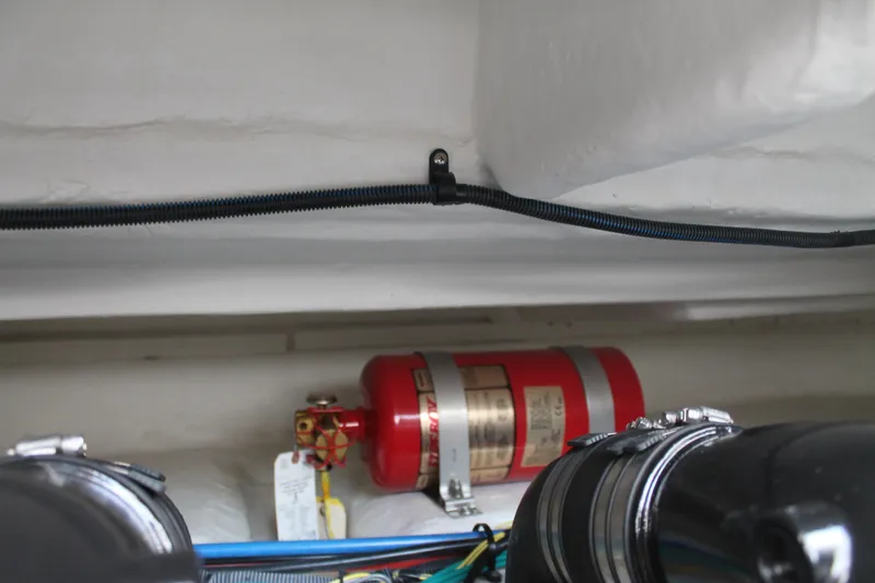 Slide: The Image of Engine compartment of 2014 Cruisers Yachts 350 Express with fire extinguisher and wiring. - 30