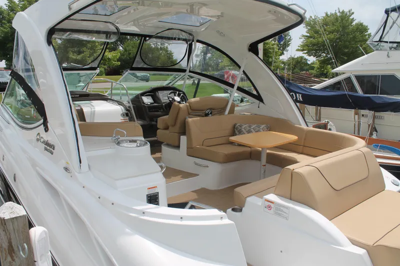 Slide: The Image of 2014 Cruisers Yachts 350 Express with spacious seating and modern interior design. - 4