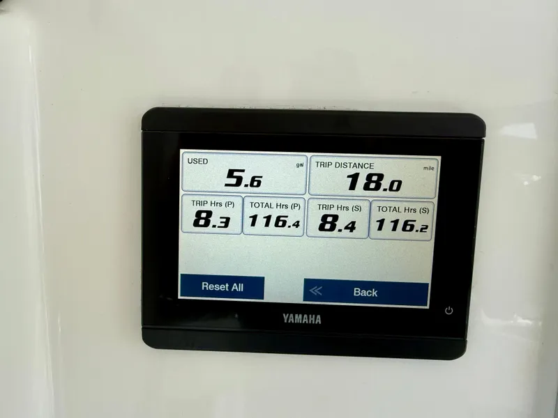 Slide: The Image of Yamaha display showing trip data: 5.6 gallons used, 18 miles distance, 2023 Regulator 23. - 21