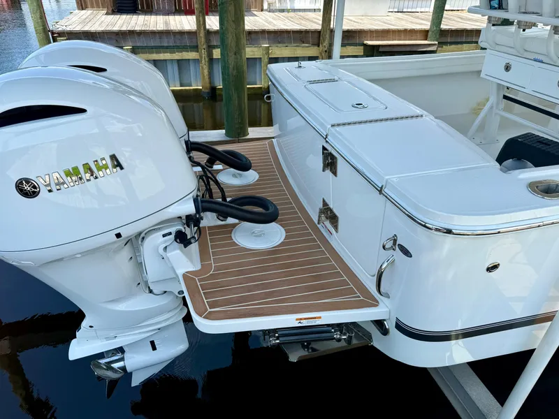 Slide: The Image of 2023 Regulator 23 boat with Yamaha engines, featuring a sleek deck and storage compartments. - 22