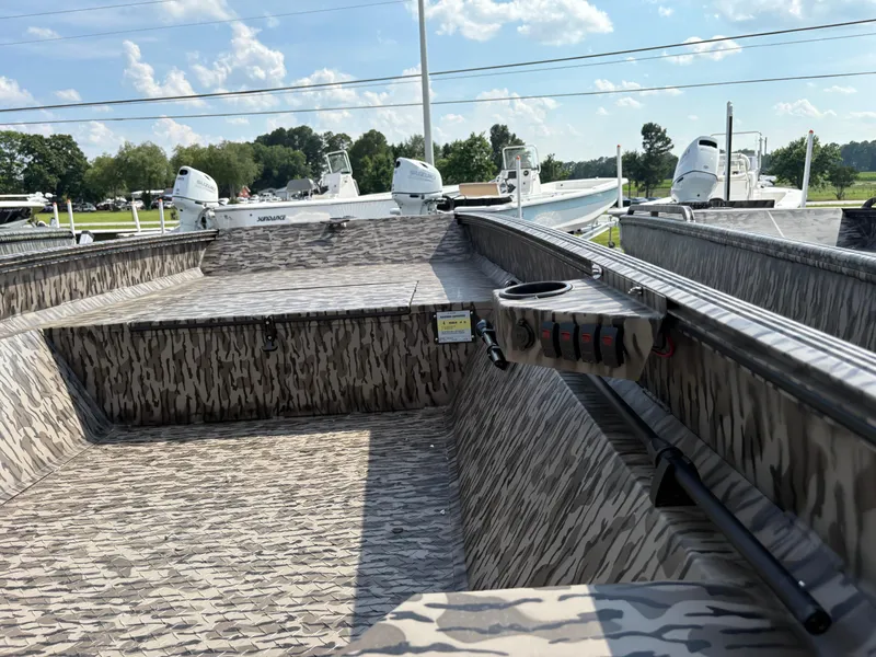 Slide: The Image of 2025 Edge Duck Boats Standard 656DB with camouflage interior, parked outdoors under a blue sky. - 3