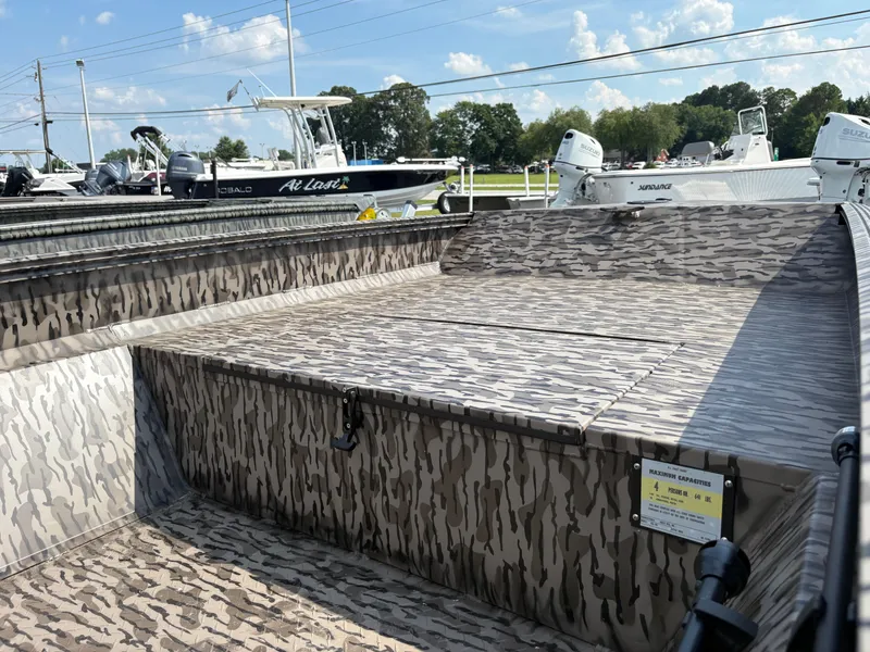 Slide: The Image of 2025 Edge Duck Boats Standard 656DB with camouflage design, displayed outdoors under a clear sky. - 5