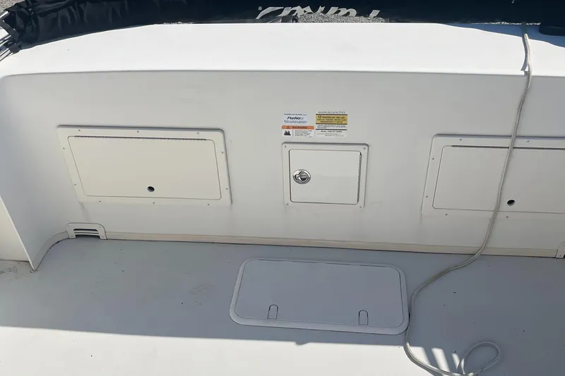 Slide: The Image of 2020 Parker 2530 Extended Sport Cabin boat deck with storage compartments. - 13